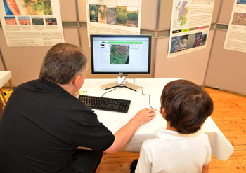 David Donnelly showing a school pupil how to enter feedback on the VLT via the Google Maps interface